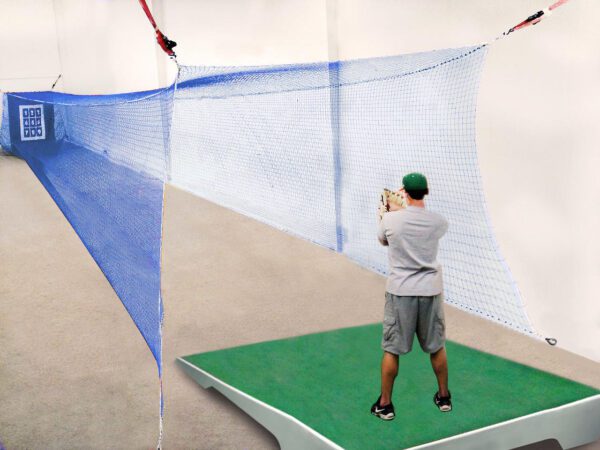 A man taking a picture of the net.