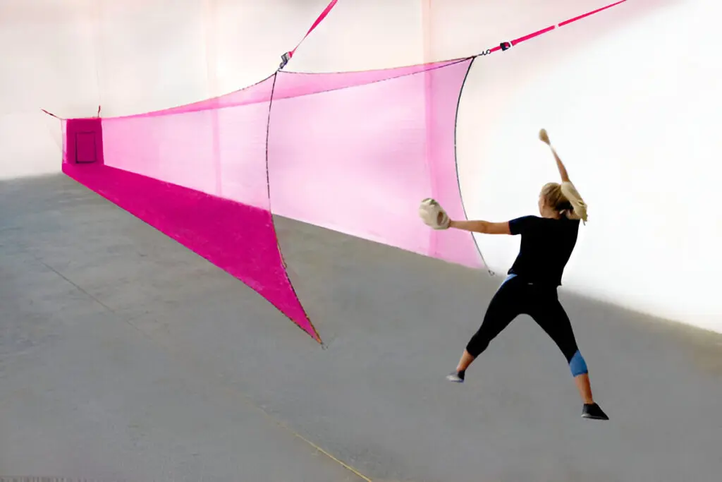 A woman is throwing a ball in the air