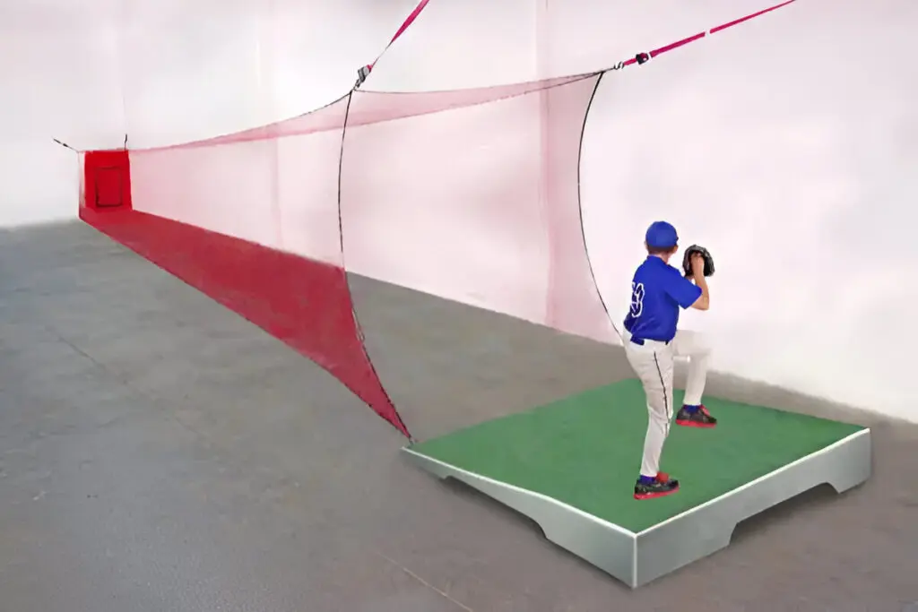 A man and woman in batting cages.